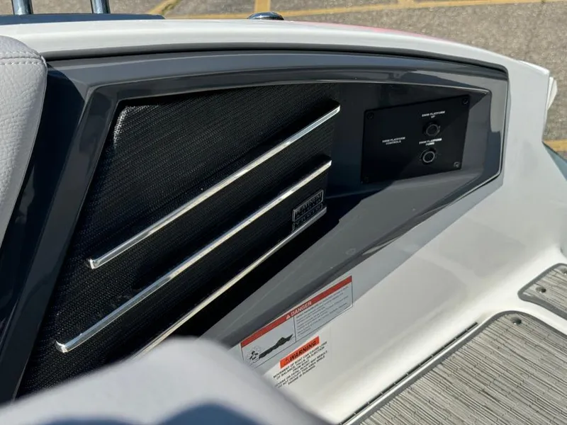 Slide: The Image of 2022 Cobalt A29 boat interior panel with controls and warning labels. - 45