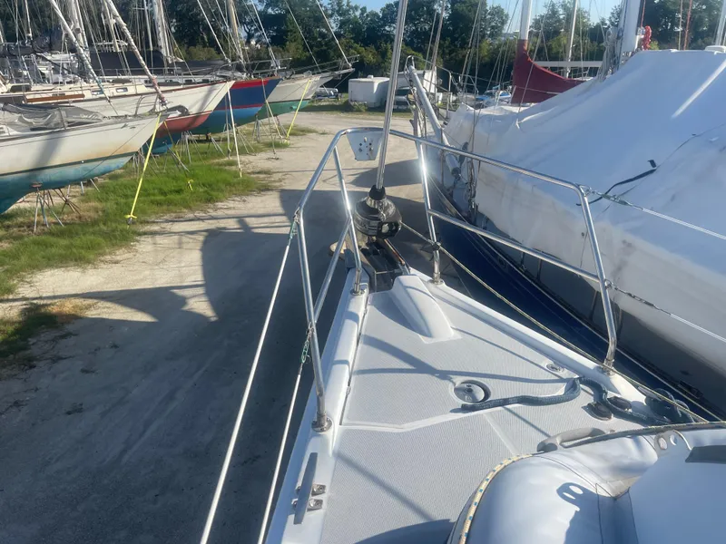 Slide: The Image of 2004 Hunter 44 DS Deck Salon sailboat cockpit with Yamaha outboard motor. - 16