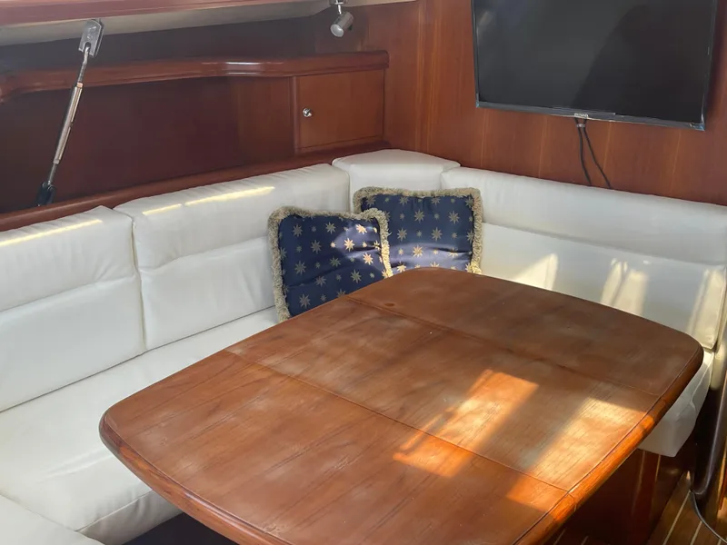 Slide: The Image of Hunter 44 DS Deck Salon 2004 sailboat with outboard motor and deck equipment. - 24