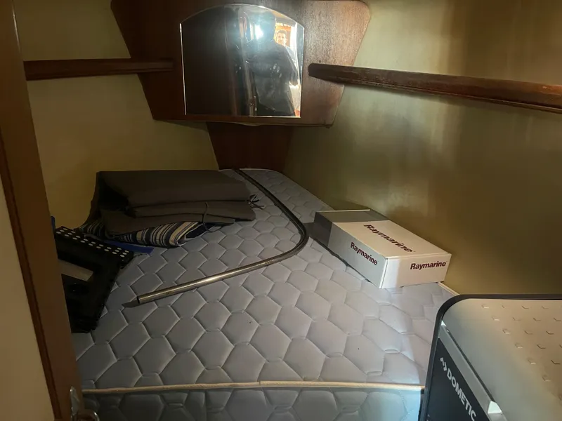 Slide: The Image of Yanmar engine in a 2004 Hunter 44 DS Deck Salon sailboat, showing detailed components. - 50