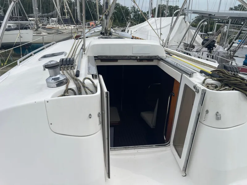 Slide: The Image of Hunter 44 DS Deck Salon 2004 sailboat on stands in a boatyard. - 6