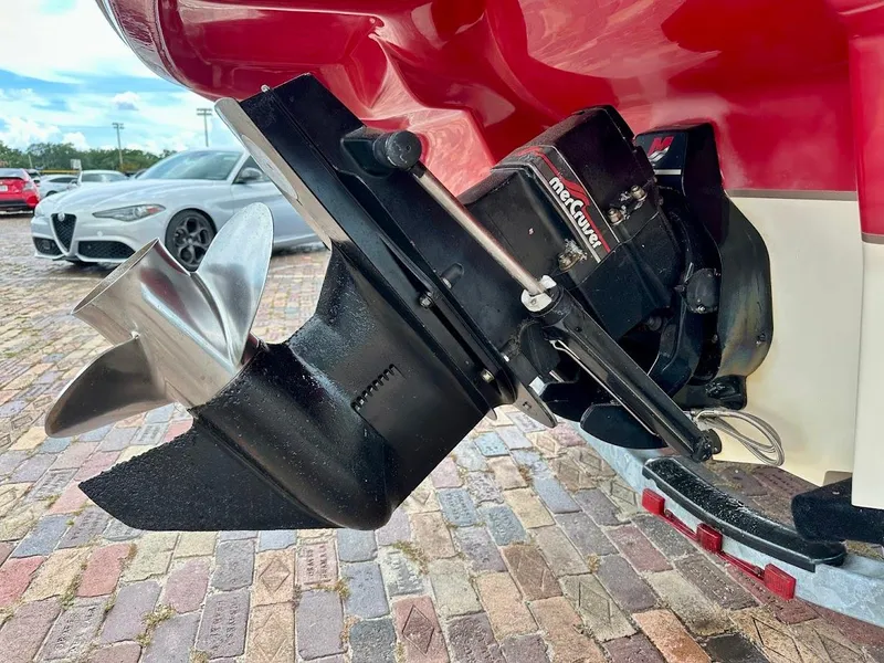 Slide: The Image of 2004 Sea Ray SunDeck 200 boat propeller and outdrive on brick pavement. - 10