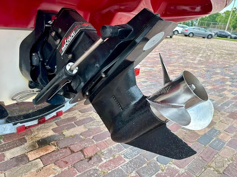 Slide: The Image of Close-up of a 2004 Sea Ray SunDeck 200 boat propeller and outdrive on a brick surface. - 12