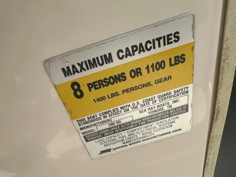 Slide: The Image of Capacity label on 2004 Sea Ray SunDeck 200, max 8 persons or 1100 lbs. - 24