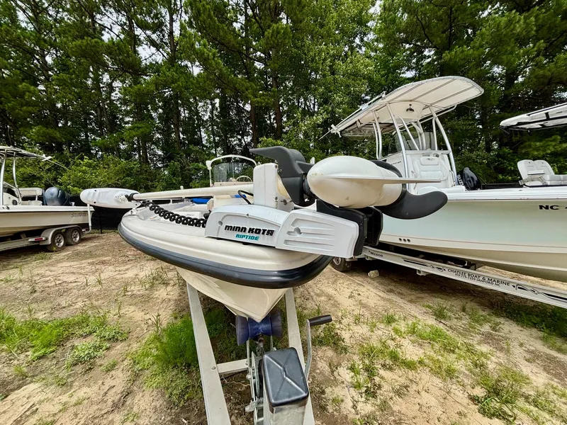 Slide: The Image of 2004 Sea Chaser 220 Bay Runner boat with Minn Kota Riptide motor, parked on trailer. - 6