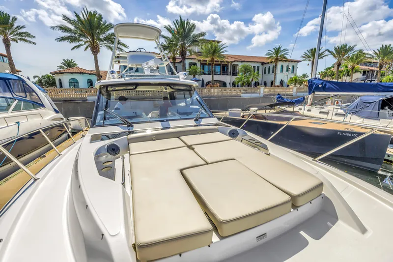 Slide: The Image of 2023 Boston Whaler 405 Conquest docked, featuring spacious deck and luxurious seating. - 29