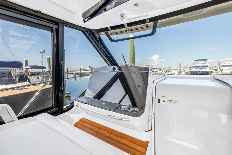 Slide: The Image of 2023 Boston Whaler 405 Conquest interior with sleek design and marina view. - 39