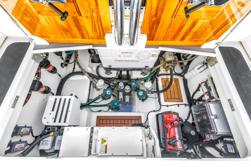 Slide: The Image of Engine room of 2023 Boston Whaler 405 Conquest, showcasing organized mechanical components and systems. - 43