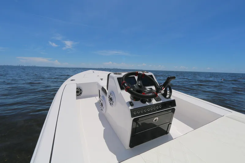 Slide: The Image of 2024 Vtech 18 boat on open water under clear blue sky. - 2