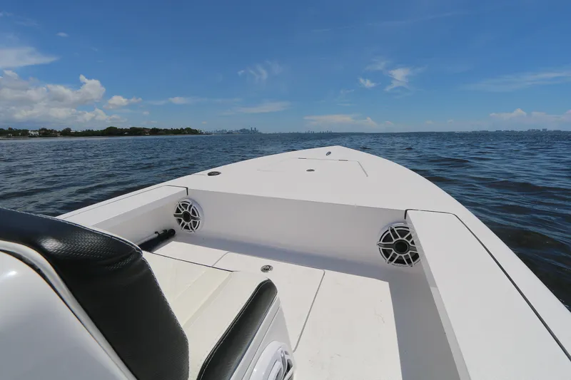 Slide: The Image of 2024 Vtech 18 boat on open water under clear blue sky. - 4