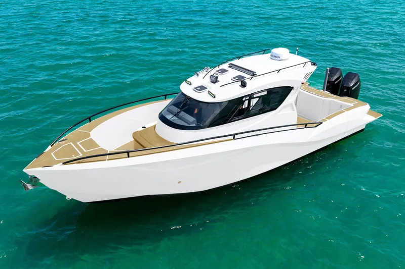 Slide: The Image of 2025 Novielli SERE boat on clear turquoise water, showcasing sleek design and modern features. - 14