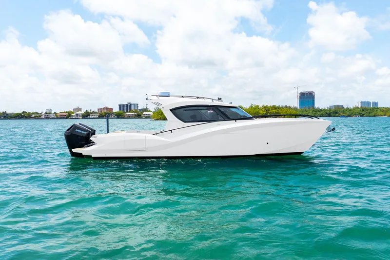 Slide: The Image of 2025 Novielli SERE boat on turquoise water under a cloudy sky. - 5