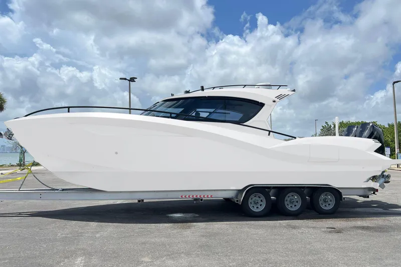 Slide: The Image of 2025 Novielli SERE boat on trailer under cloudy sky. - 8