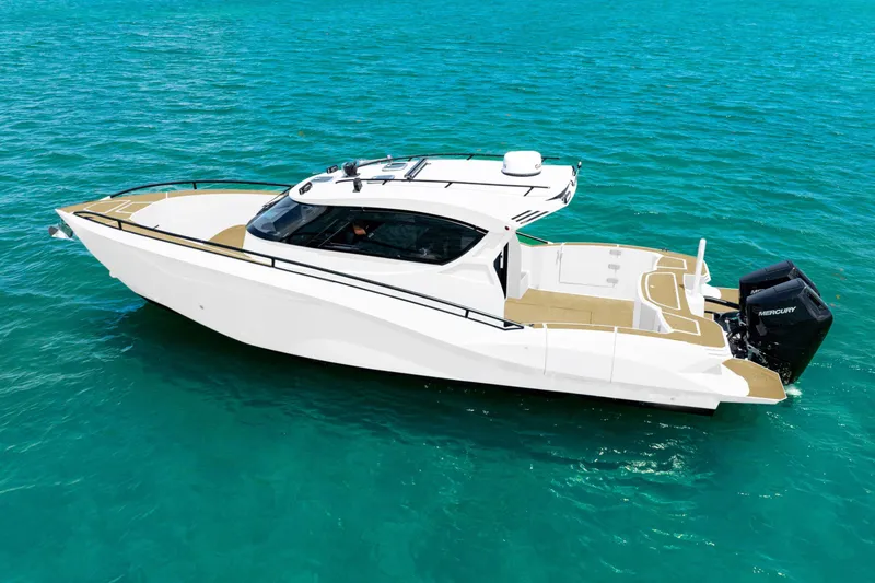 Slide: The Image of 2025 Novielli SERE boat on clear blue water, showcasing sleek design and powerful engine. - 9