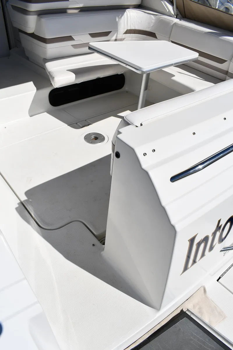 Slide: The Image of 2002 Formula 31 PC boat interior with seating and table. - 15