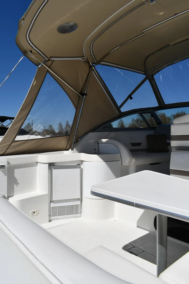 Slide: The Image of 2002 Formula 31 PC boat interior with canopy and seating area. - 17