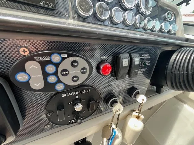 Slide: The Image of Control panel of a 2002 Formula 31 PC boat with Kenwood audio system. - 23