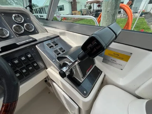 Slide: The Image of Control panel of a 2002 Formula 31 PC boat with throttle and gauges. - 25