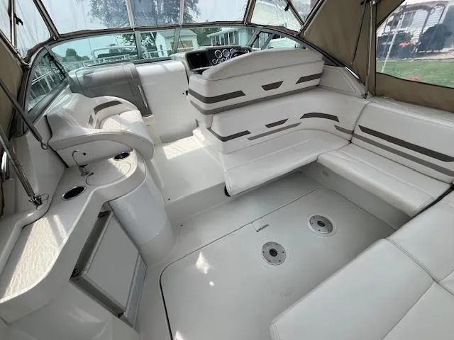 Slide: The Image of 2002 Formula 31 PC boat interior with white seating and helm. - 29