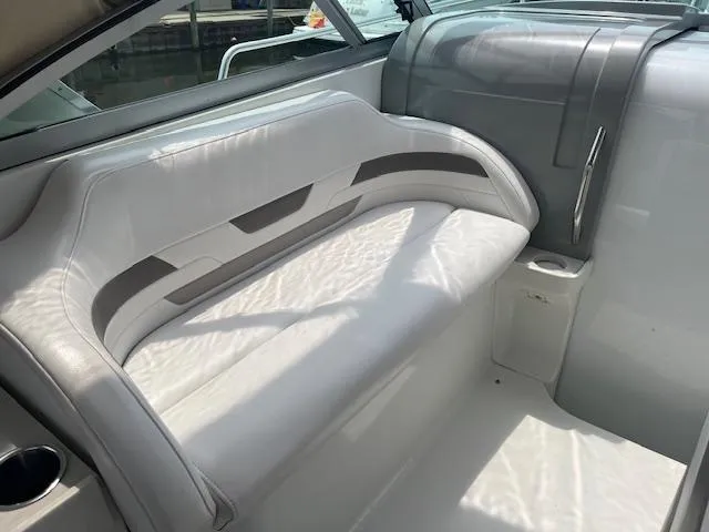 Slide: The Image of 2002 Formula 31 PC boat interior with white leather seating and cup holder. - 30