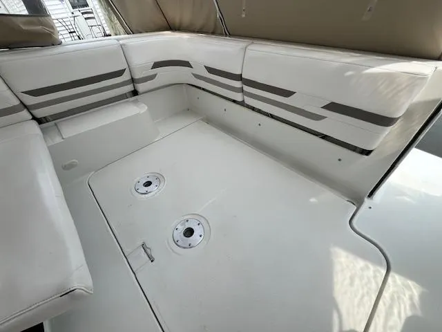 Slide: The Image of 2002 Formula 31 PC boat interior with white seating and striped design. - 31