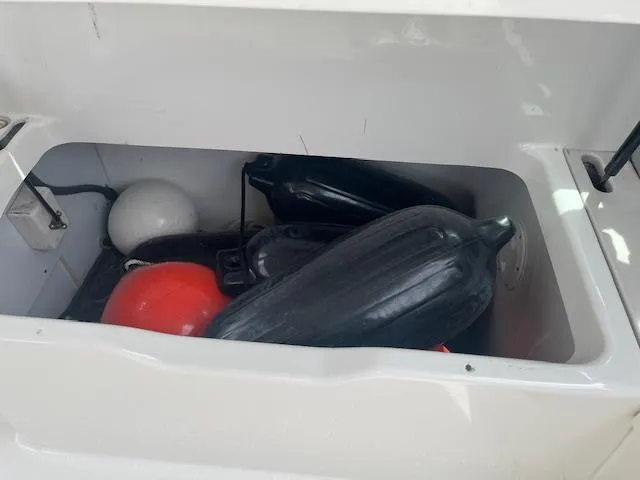 Slide: The Image of Storage compartment with boat fenders and buoys on a 2002 Formula 31 PC. - 32