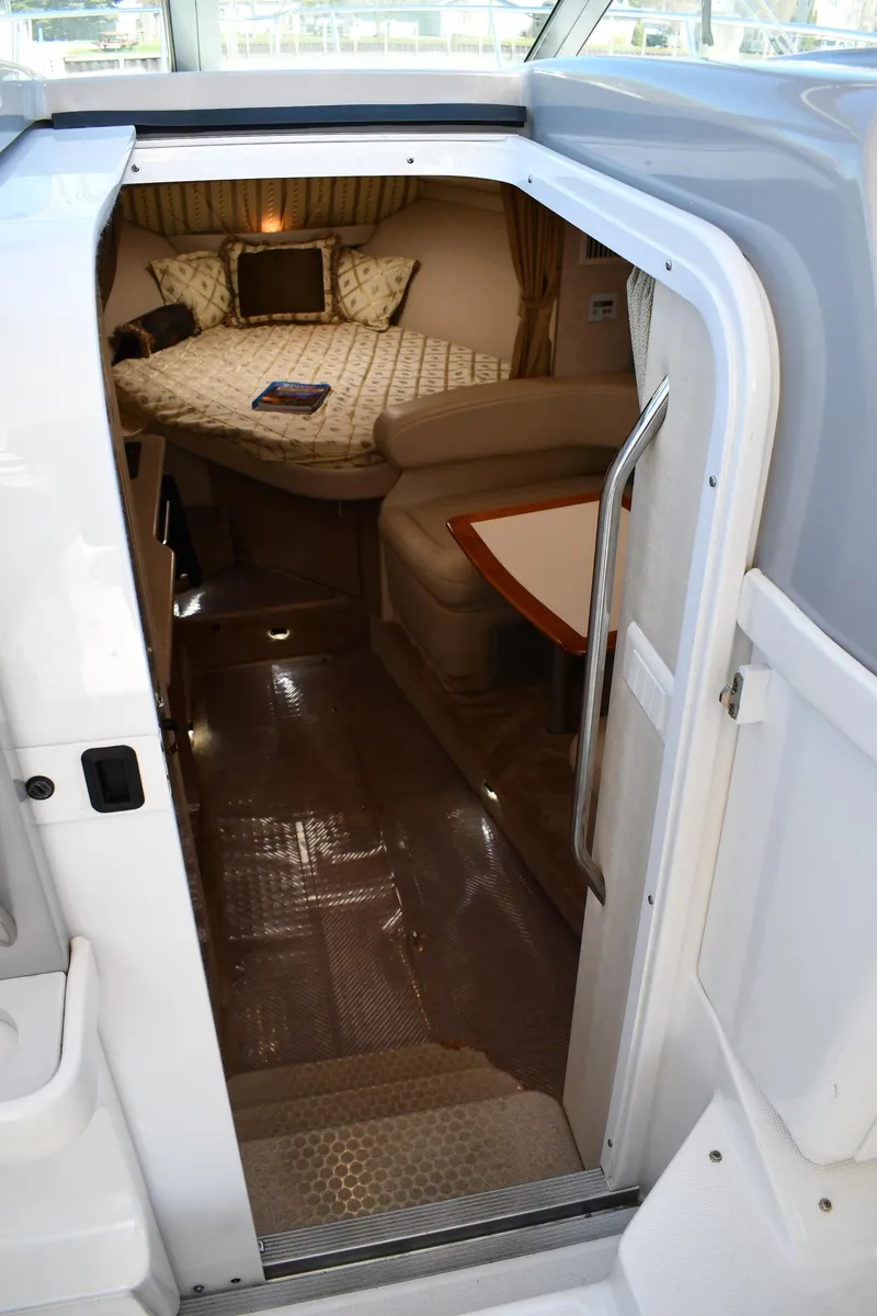 Slide: The Image of 2002 Formula 31 PC cabin interior with cozy seating and bed. - 38