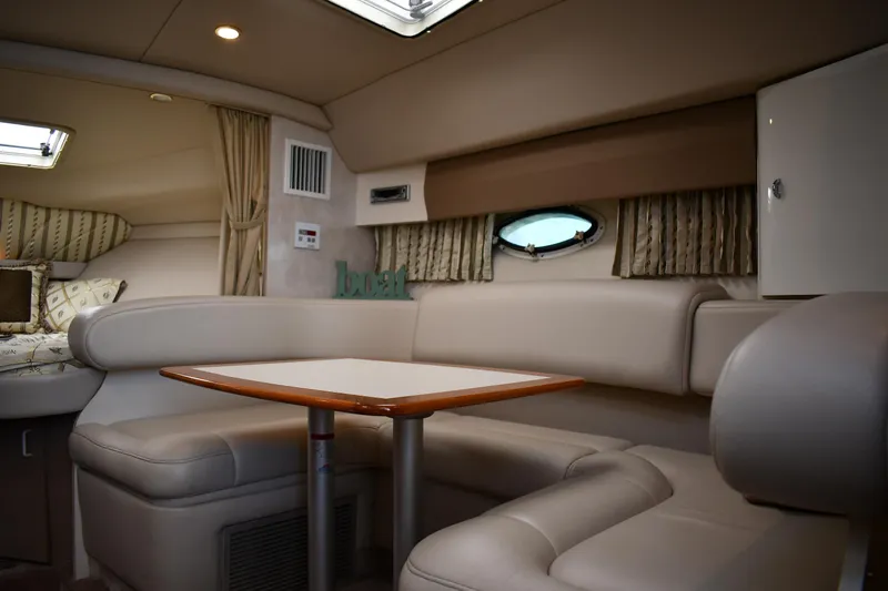 Slide: The Image of Luxurious interior of a 2002 Formula 31 PC yacht with plush seating and elegant table. - 39