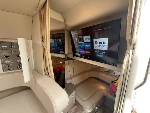 Slide: The Image of Luxurious interior of a 2002 Formula 31 PC yacht with modern entertainment system. - 42