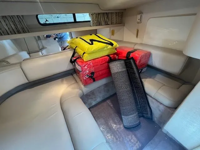 Slide: The Image of Interior of a 2002 Formula 31 PC boat with seating and stored life jackets. - 44
