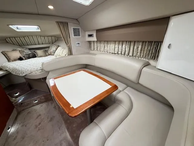 Slide: The Image of Interior of a 2002 Formula 31 PC yacht with a cozy seating area and bed. - 47