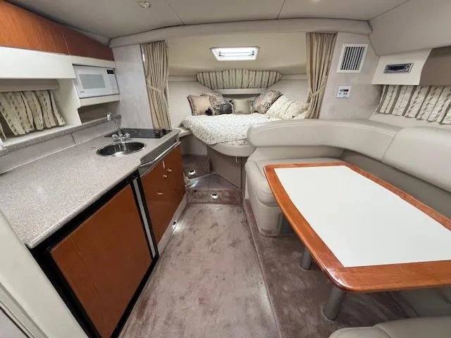 Slide: The Image of Interior of a 2002 Formula 31 PC yacht with kitchenette and cozy sleeping area. - 48