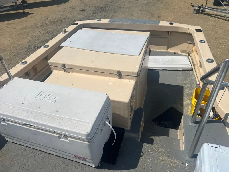 Slide: The Image of 1984 JC 35 boat deck with Igloo coolers and storage compartments. - 21