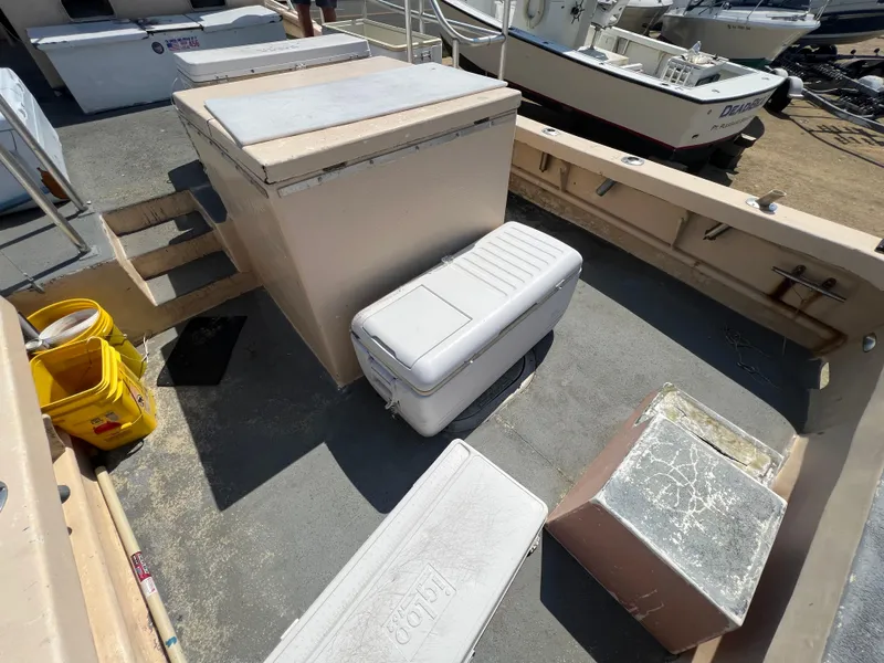 Slide: The Image of Deck of 1984 JC 35 boat with coolers and storage boxes. - 22