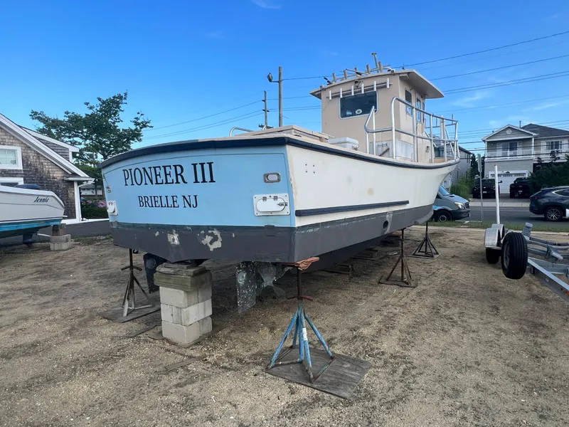 Slide: The Image of 1984 JC 35 boat "Pioneer III" on blocks in Brielle, NJ. - 3