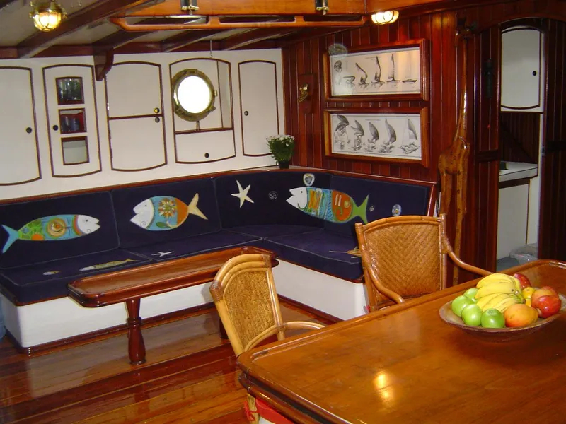 Slide: The Image of Interior of 1991 Custom Horacio Carabelli Schooner with nautical decor and wooden furnishings. - 13