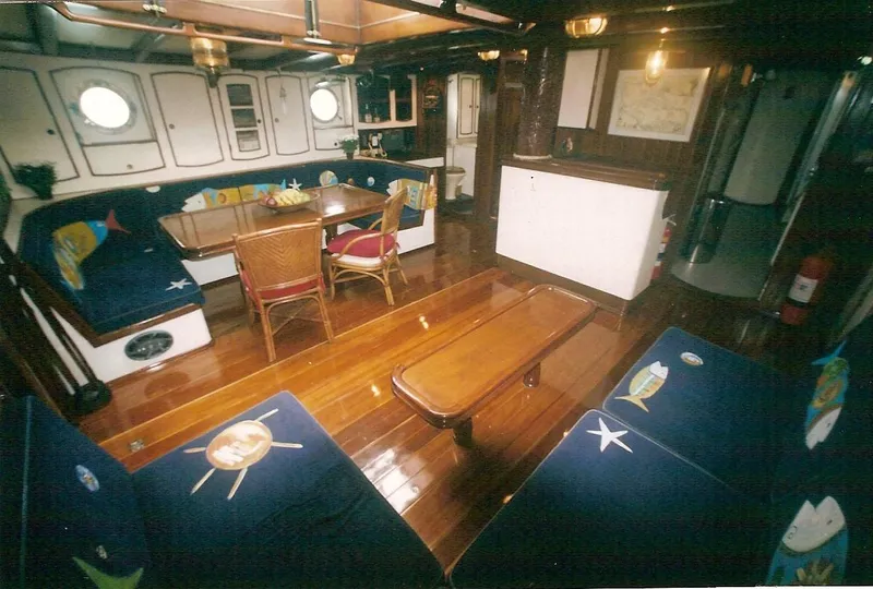 Slide: The Image of Interior of 1991 Custom Horacio Carabelli Schooner with wooden furnishings and nautical decor. - 18