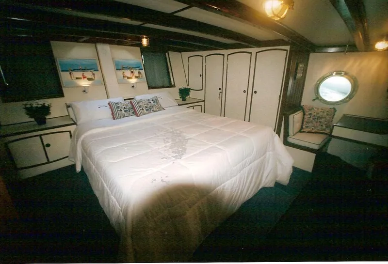 Slide: The Image of Luxurious cabin interior of 1991 Custom Horacio Carabelli Schooner with cozy bed and nautical decor. - 20