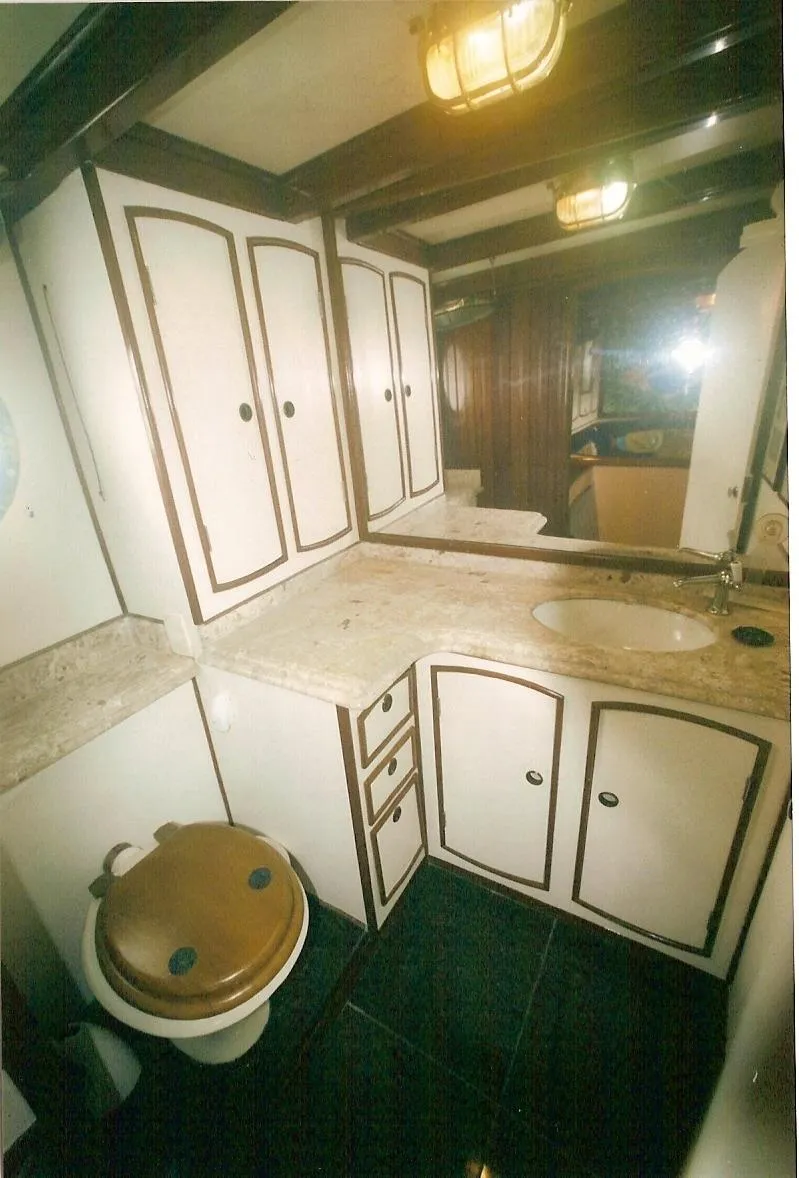 Slide: The Image of Luxurious bathroom interior of 1991 Custom Horacio Carabelli Schooner with elegant cabinetry and fixtures. - 26