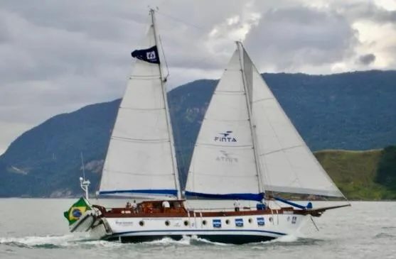 Slide: The Image of Sailing schooner "Horacio Carabelli" from 1991 on open water, Brazilian flag, cloudy sky. - 30