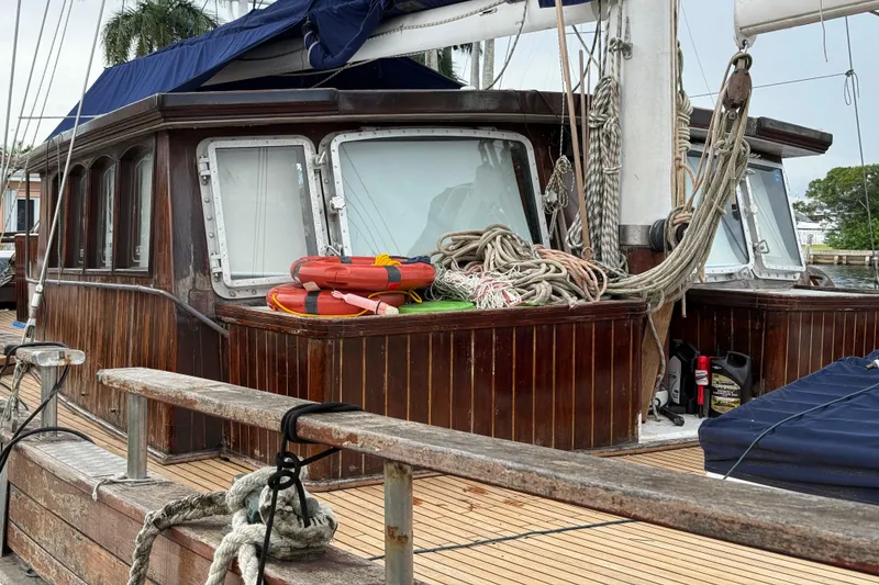Slide: The Image of Wooden deck of 1991 Custom Horacio Carabelli Schooner with ropes and lifebuoys. - 35