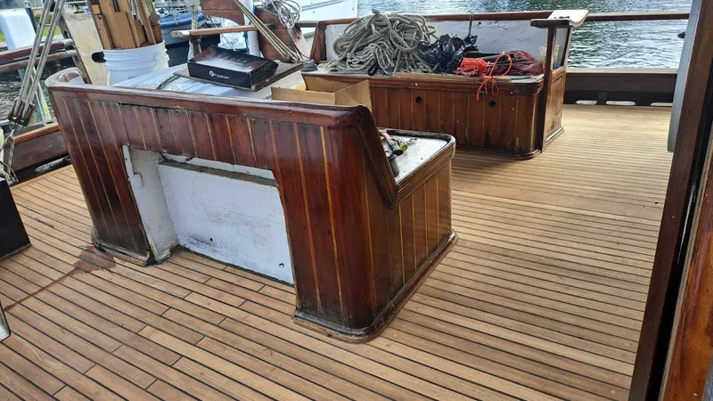 Slide: The Image of Wooden deck of 1991 Custom Horacio Carabelli Schooner with benches and nautical equipment. - 38