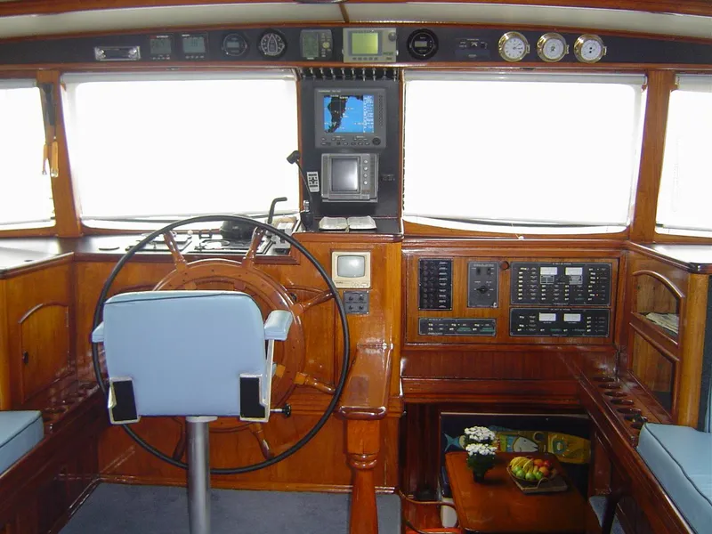 Slide: The Image of Cockpit of 1991 Custom Horacio Carabelli Schooner with wooden helm and navigation instruments. - 6