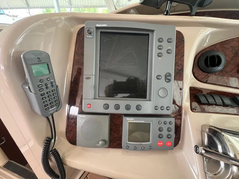 Slide: The Image of Control panel of 2004 Sea Ray 480 Motor Yacht with navigation and communication equipment. - 15