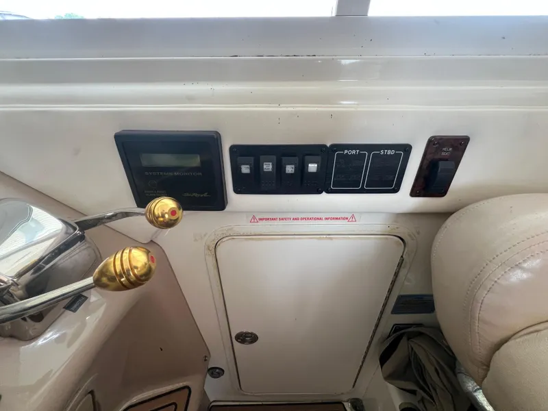 Slide: The Image of Control panel of a 2004 Sea Ray 480 Motor Yacht with switches and levers. - 18