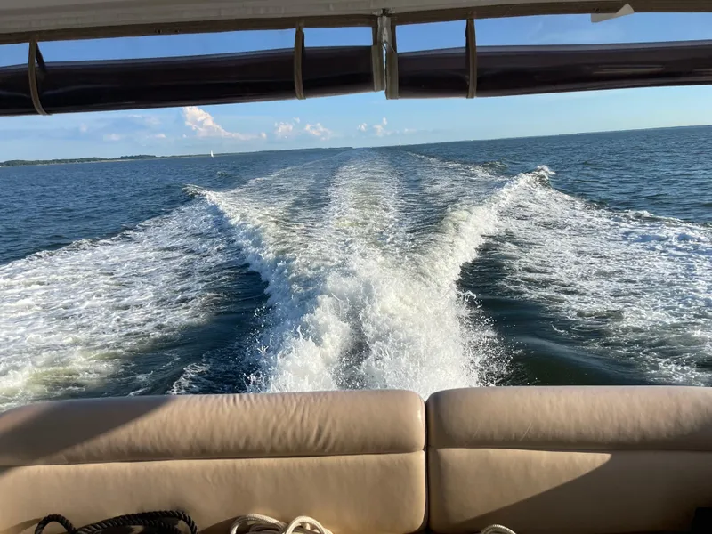 Slide: The Image of Wake behind a 2004 Sea Ray 480 Motor Yacht on open water. - 2