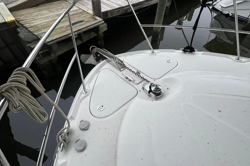 Slide: The Image of Bow of a 2004 Sea Ray 480 Motor Yacht with anchor chain and docked at marina. - 23