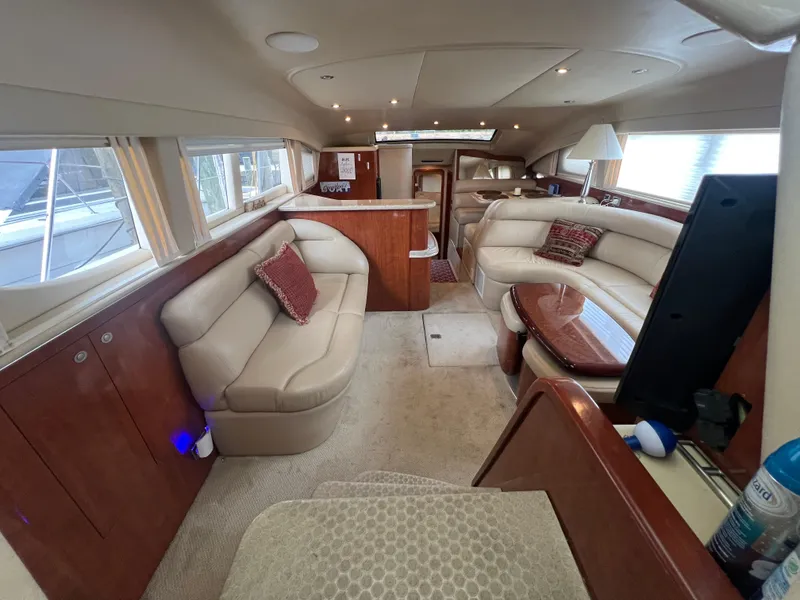 Slide: The Image of Luxurious interior of 2004 Sea Ray 480 Motor Yacht with plush seating and elegant wood finishes. - 28