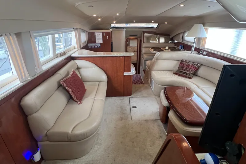 Slide: The Image of Luxurious interior of 2004 Sea Ray 480 Motor Yacht with plush seating and elegant decor. - 29