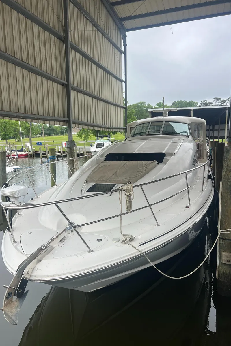 Slide: The Image of 2004 Sea Ray 480 Motor Yacht docked in a covered marina. - 3